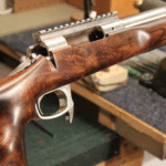 Finished walnut rifle stock close-up