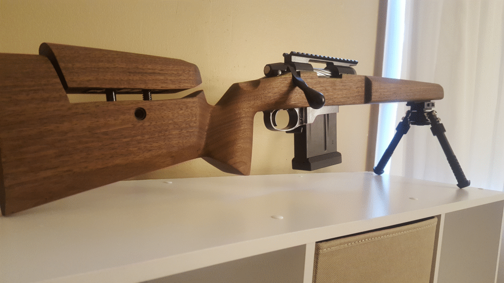 Custom walnut rifle stock showing craftsmanship